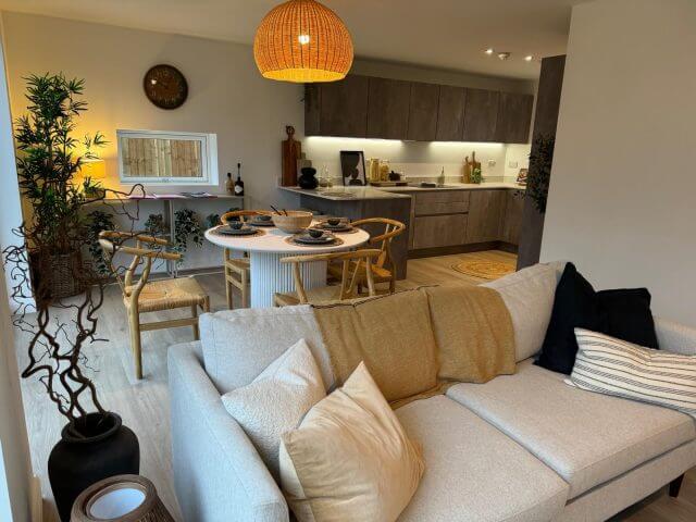 Modern German kitchen with wood-effect cabinets and dark kitchen island